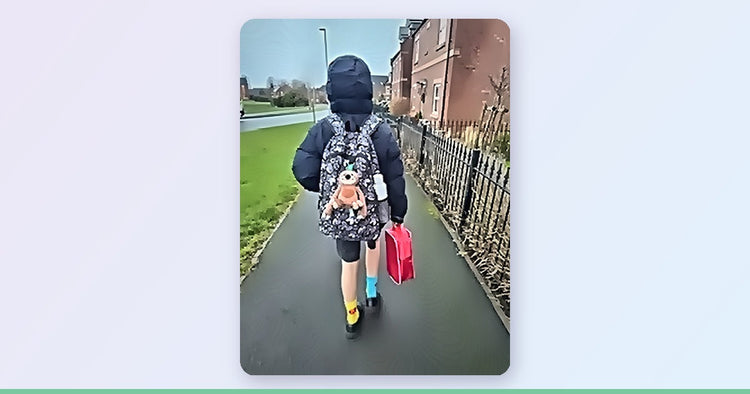 Child walking to school with a talking Sloth plushie clipped to their backpack